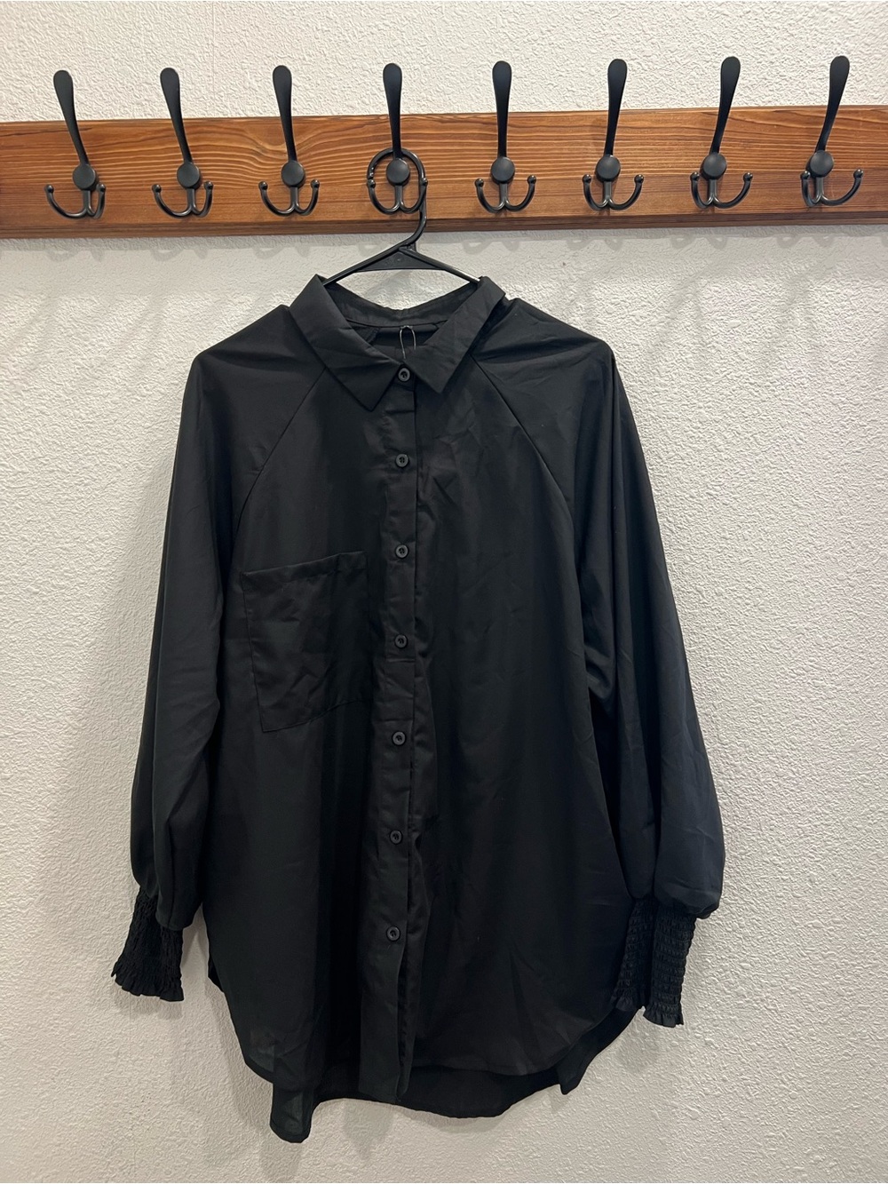 Black Long-Sleeve Button-Up Blouse with Smocked Cuffs